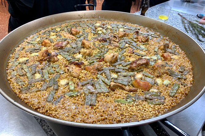 Valencian paella cooking class, tapas and visit to Ruzafa market. - Walking eight minutes to the cooking kitchen
